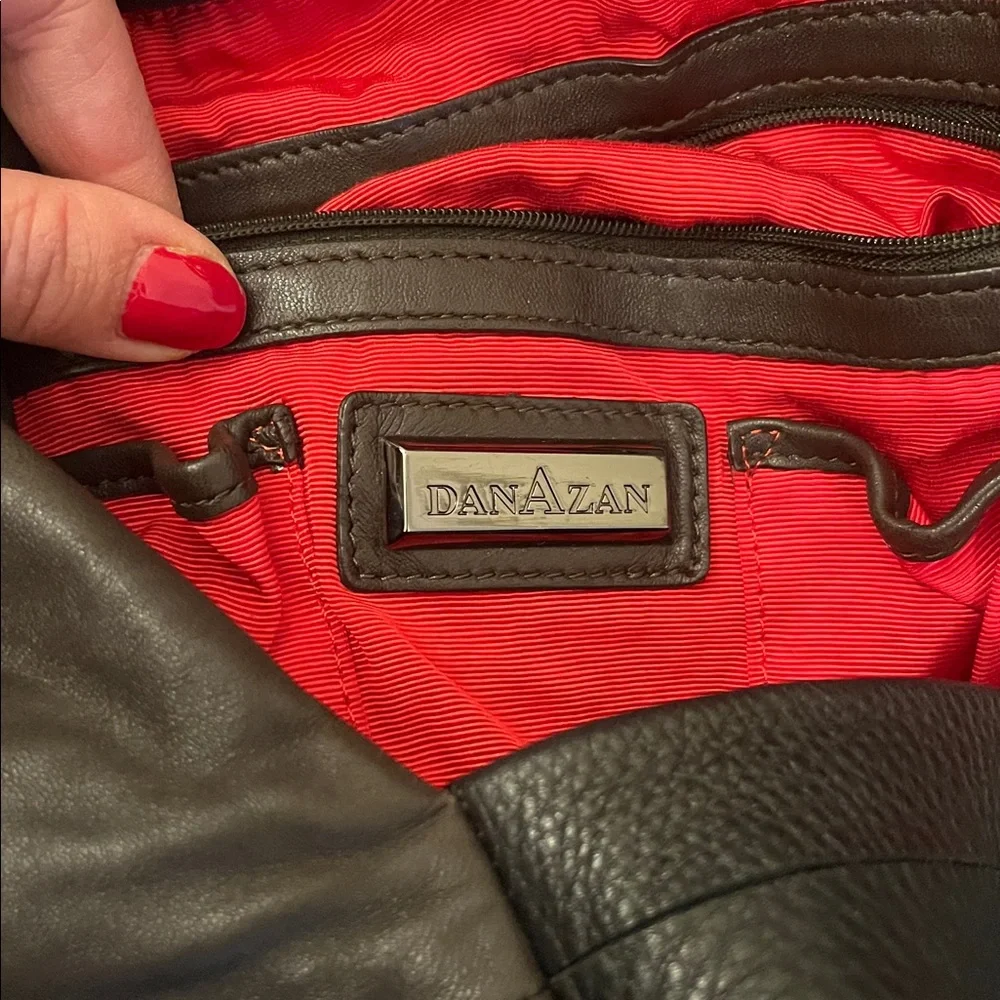 DanAzan slouchy one shoulder bag in brown leather with black adjustable strap